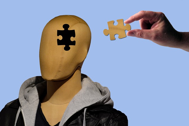 5 Things That Prove Depression is Real - A mannequin with a missing puzzle piece in its head. A person is about to put puzzle piece in place
